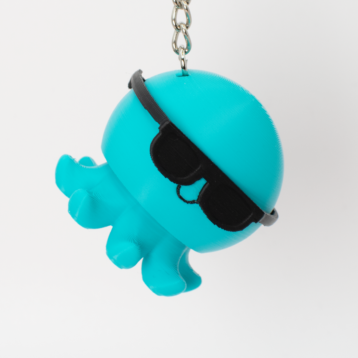 Party Octopus Fidget Clicker, teal, with sunglasses, as a bag charm
