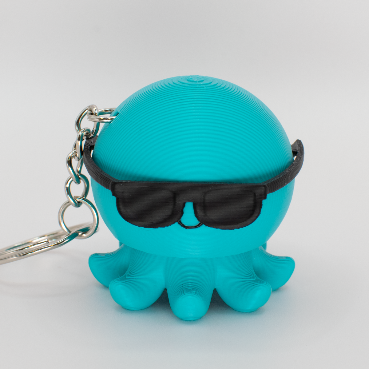Party Octopus Fidget Clicker, teal, with sunglasses