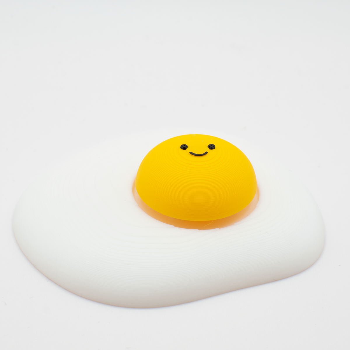 Fried Egg Fidget Clicker, side view