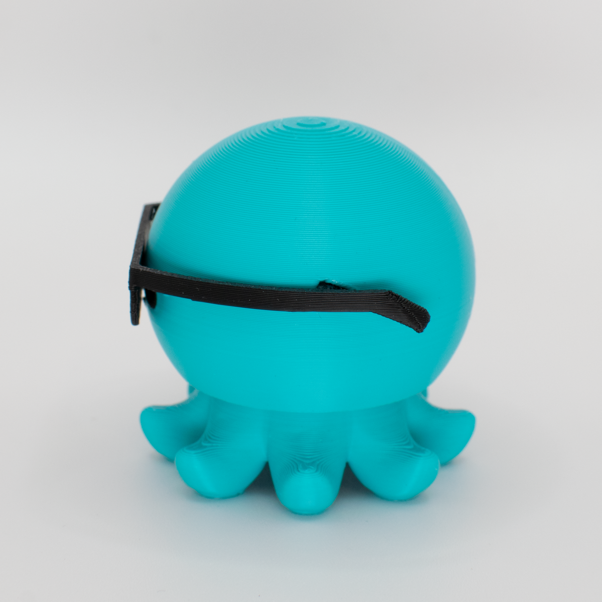 Party Octopus Fidget Clicker, teal, side view