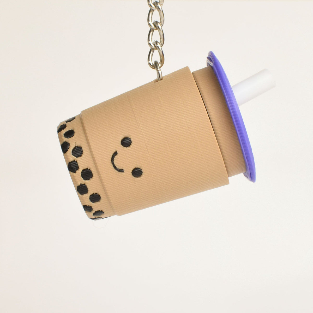 Bubble Tea Fidget Clicker, purple lid, as a bag charm