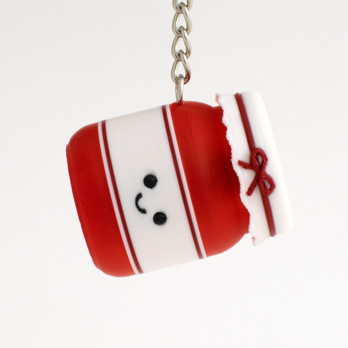 Strawberry Jam Jar Fidget Clicker, as a bag charm