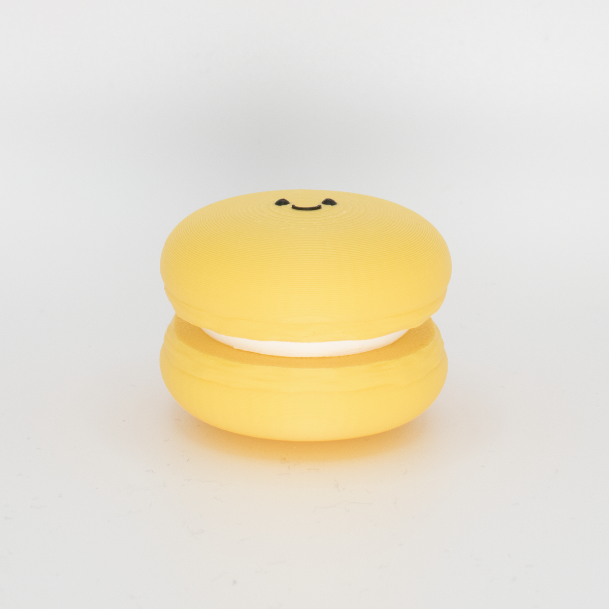 Smiley Macaron Fidget Clicker, lemon, side view