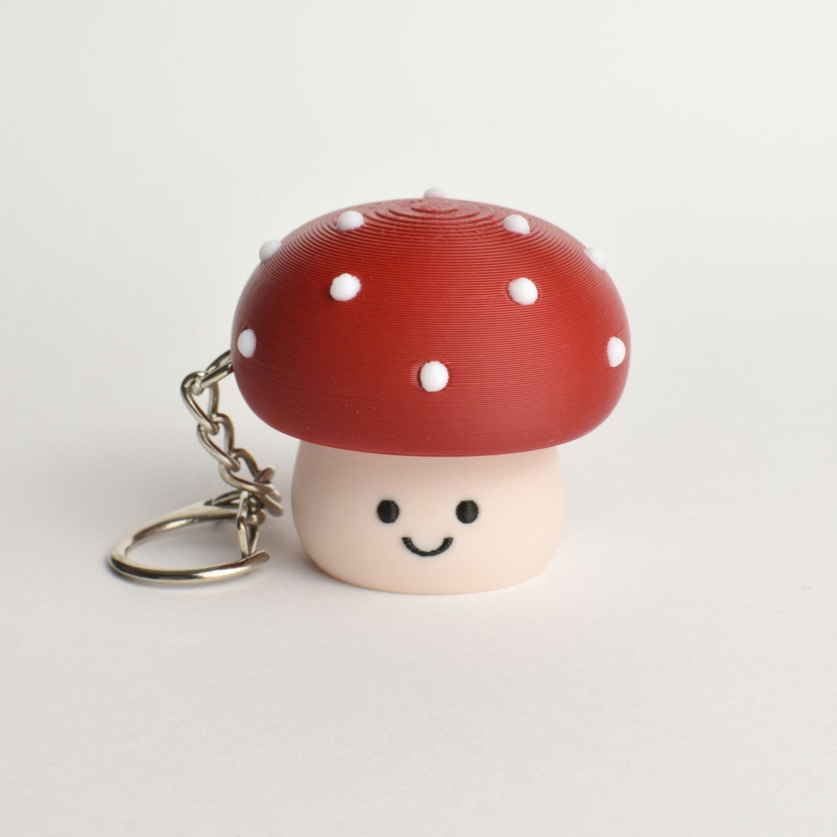 Red Mushroom Fidget Clicker, on a keychain