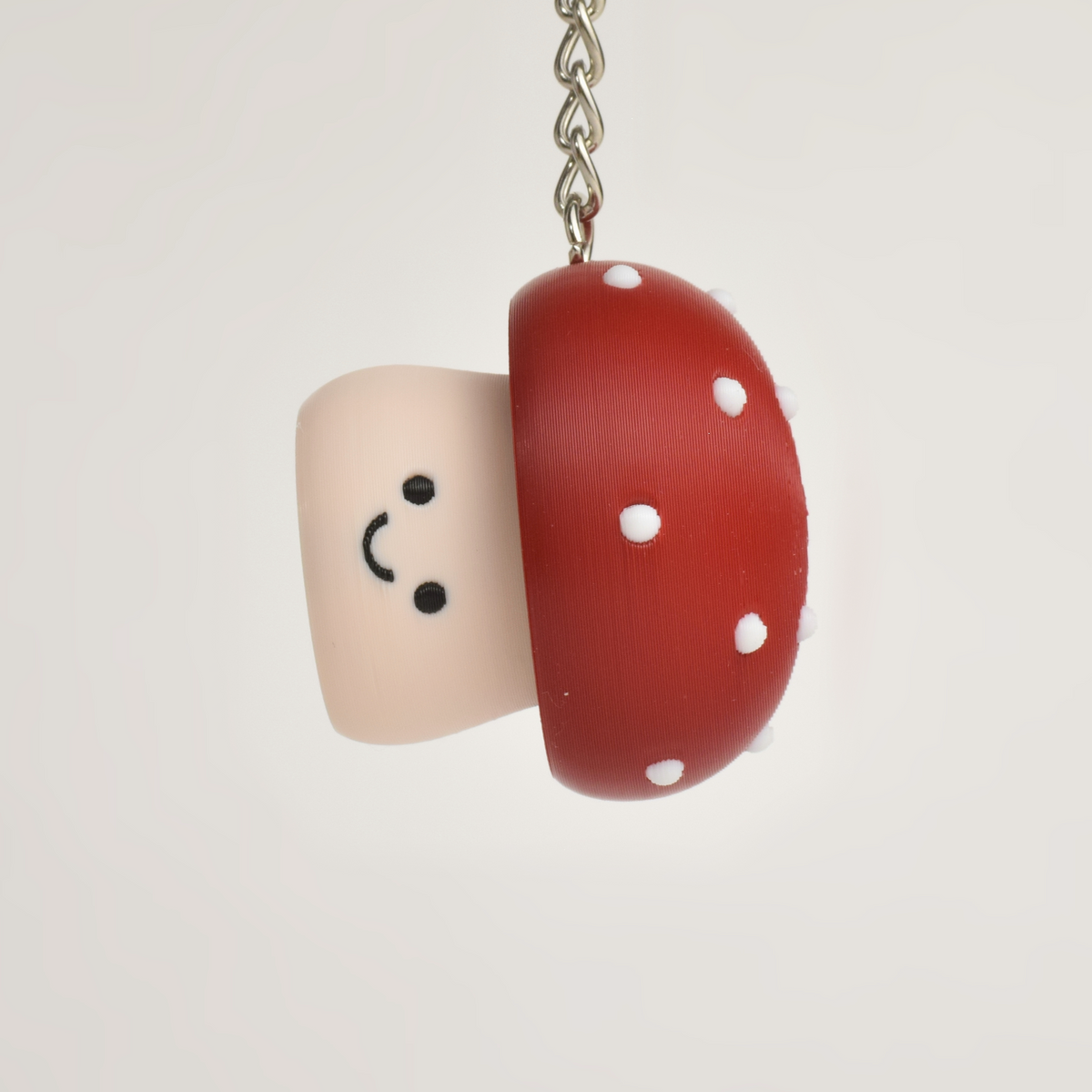 Red Mushroom Fidget Clicker, on a keychain