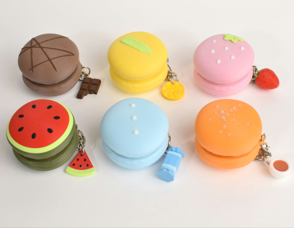Mystery Macaron Fidget Clicker, all six designs